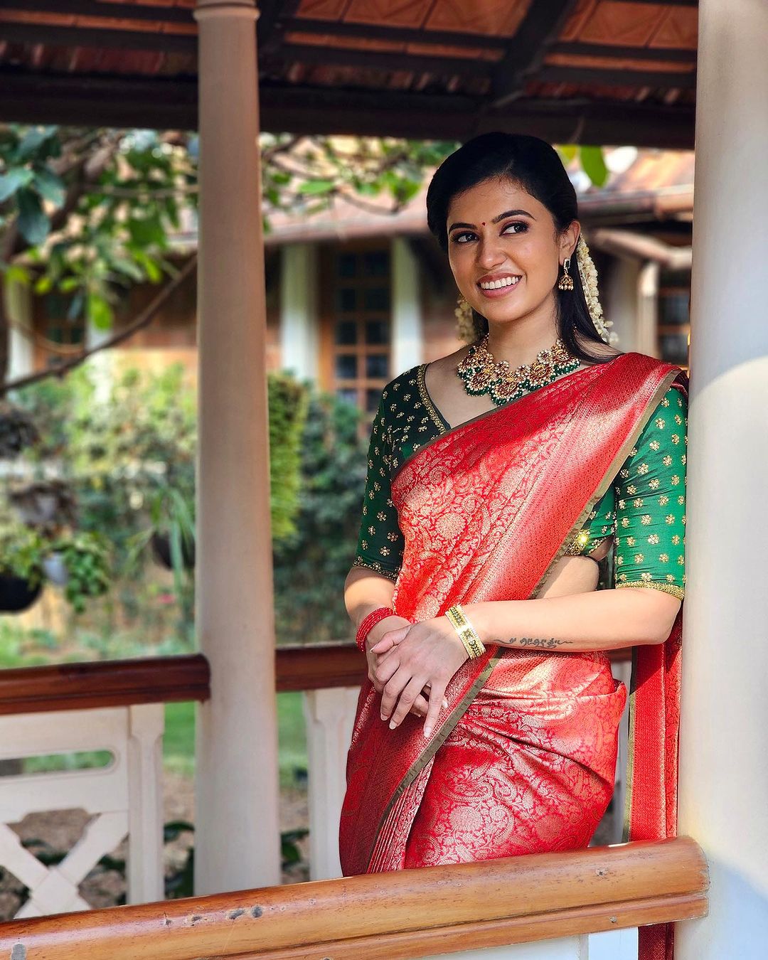 Tamil Actress Anju Kurian Stills in Red Saree Green Blouse